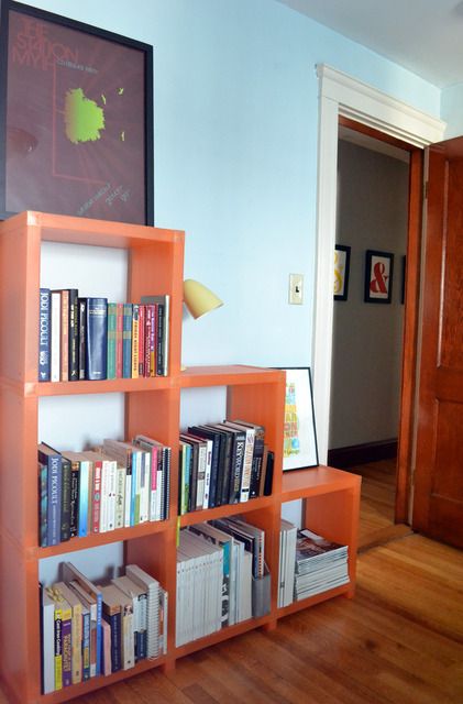 digging the orange bookshelves... Orange Bookshelf, Orange Bookshelves, Blue Bookshelves, Cool Shelves, Adjustable Shelf, House Tour, Beautiful Home, Apartment Therapy, House Stuff