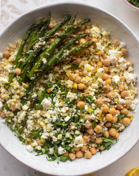 spring couscous bowls with lemon feta vinaigrette Feta Vinaigrette, Couscous Bowls, Spring Eats, Couscous Salat, Sides Recipes, Spring Dinner, Roasted Asparagus, Spring Recipes, What To Eat