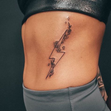 My Protector Tattoo, Tattoo Ideas Back Of Forearm, Lightning Bolt With Flowers Tattoo, Cute Punchy Tattoos, Western Tattoos For Women Ribs, Small Tattoo Western, Feminine Lightning Bolt Tattoo, Koe Wetzel Fyfg Tattoo, Lightening Bolt Tattoo Women