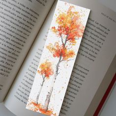 LAMINTAED BOOKMARK Celebrate the fiery hues of fall with this vibrant watercolor bookmark. Featuring a majestic maple tree in full autumn splendor, this bookmark is a must-have for those who revel in the season's dramatic colors. Handmade with care, it's the perfect companion for your autumn reads. Handmade Stationary Each item features a high-quality print of the original watercolor artwork. SIZE 2 X 6 Inches --------------------------------------------------------- IMPORTANT Shipping Details: We ship out orders on the same day or the next. Orders received during weekends will be sent out on the next working day. Please Be Aware: Orders not sent Priority mail are all sent as 1st class mail, and will not be sent with a tracking option. These are mailed through USPS, similar to how a stampe Best Bookmark Ideas, Simple Nature Watercolor, Fall Watercolors Easy, Autumn Watercolor Bookmark, Fall Watercolor Bookmarks, Bookmark Watercolor Ideas, Fall Watercolor Ideas, Bookmarks Handmade Watercolor, Diy Bookmarks Watercolor