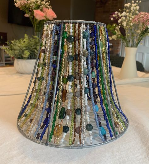 Each lampshade is meticulously hand beaded by yours truly :) Made with great care and attention to detail, this lampshade will be a unique addition to any room in your home or office! This lampshade includes Indian and marine agate gemstones, strung on sturdy beading wire! It also features glass beads to compliment the gemstones, the colors featured are in shades of blue, green, gold and white. This lampshade took me over a month to make! It can take days or weeks to source the perfect lampshade Colored Wire Crafts, Beaded Lampshade Diy, Diy Lamp Shade Makeover, Beaded Lamp Shade, Abat-jour Diy, Witchy Bedroom, Beaded Lampshade, Beaded Lamps, Lampshade Makeover