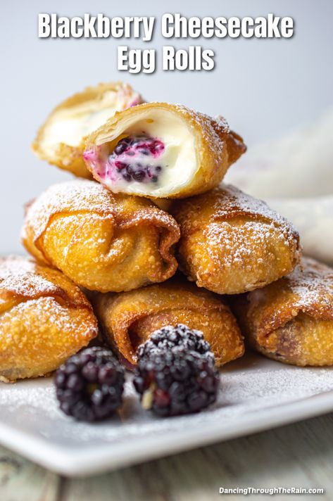 A pile of five Blackberry Cheesecake Egg Rolls on a white square plate with one cut open so you can see soft cheesecake filling and a blackberry Fruit Filled Egg Rolls, Sweet Spring Rolls Desserts, Fruit Filled Eggrolls, Cheesecake Spring Rolls, Desert Spring Rolls, Egg Roll Wrapper Desserts, Sweet Egg Rolls Desserts, Dessert Spring Rolls, Egg Roll Filling Ideas