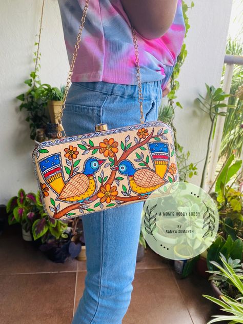 Handpainted Madhubani on box clutch. DM to order or WhatsApp number in bio Hand Painted Bags Handbags, Painted Clutches, Artistic Home Decor, Decor Palette, Canvas Sling Bag, Bag Painting, Painted Purse, Hanging Diy, Lippan Art