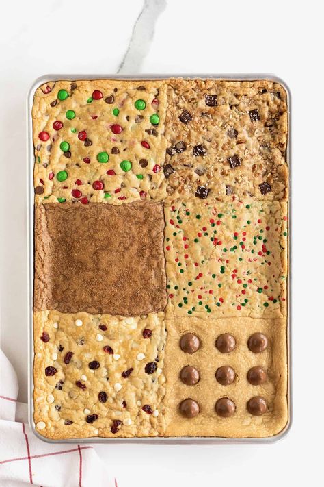 Six kinds of holiday cookie bars in an aluminum baking sheet. Sheet Cookie Bars, Sheet Pan Cookie Cake, Holiday Cookie Bars, Poker Food, Sheet Pan Cookies, Baker Mama, Peanut Butter Kiss Cookies, Pumpkin Sheet Cake, Pan Cookies