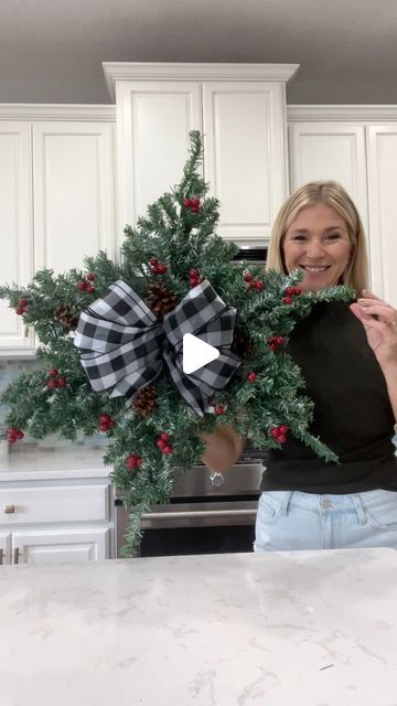 Laura Jeanne on Instagram: "Another Dollar Tree hack using mini Christmas trees 🎄 How pretty and simple is this snowflake wreath?!! 🥰  With the exception of the ribbon, everything was purchased from Dollar Tree.  I’m considering adding lights…🫣😭 I guess it depends on where I decide to hang it.  What do you think? #christmas2023 #christmasiscoming #christmasdiy #christmasdecorations #foryoupagereels #fypシ゚ #dollartreehacks" Dollar Tree Snowflake Wreath, Dollar Tree Christmas Crafts Diy 2023, Dollar Tree Christmas Tree Ideas, Snowflake Wreaths, Christmas Tree Wreath Diy, Diy Snowflake Wreath, Christmas Snowflakes Wreath, Mini Christmas Trees, Christmas Wreath Craft