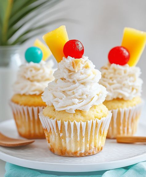 These Piña Colada Cupcakes are a tropical treat, blending pineapple and coconut for a moist, flavorful dessert. Perfect for any occasion! Pina Colada Cupcakes, Rum Extract, Pineapple And Coconut, Pineapple Rum, Filled Cupcakes, Cupcakes Recipe, Cupcake Pan, Crushed Pineapple, Maraschino Cherry