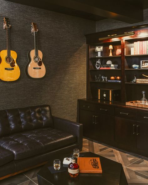 A quiet corner of a man's office designed for relaxation, reflection or if so inclined, socialization. Design: @interiorsbyseashal Photo: @davebrycephoto #officedesign #officedesigns #officedesigntrends #officedecoration #officedecor #home #interiordesigner #painteriordesigner #PAinteriordesigner #pittsburghluxuryhome #pittsburghluxuryhomes #pittsburghluxury Guitarist Room, Dark Moody Basement, Men’s Home Office, Moody Basement, Man's Office, Industrial Apartment Decor, Basement Home Office, Dark Interior Design, Office Design Trends