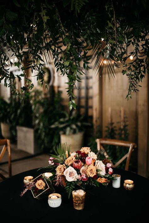 Dark Moody Tropical Wedding, Moody Reception Decor, Moody Tropical Wedding, Greenery Arbor, Palm House Wedding, Moody Tropical, Gold Centerpiece, Tropical Centerpieces, Geometric Centerpiece