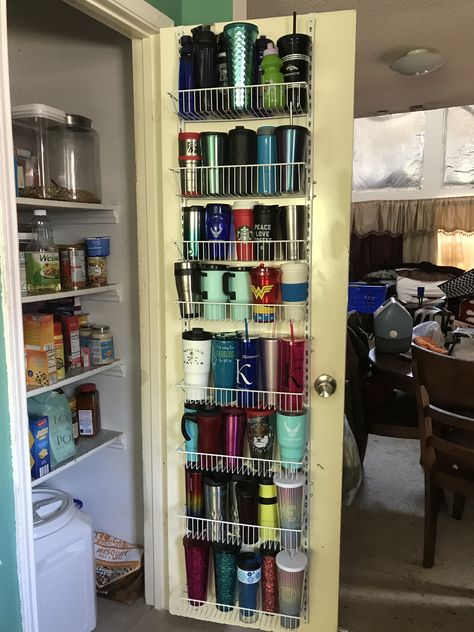 Over the door organizer used to hold tumblers, coffee cups, and water bottles. Starbucks Tumbler Organizer, Diy Cup Organizer Organization Ideas, Over The Door Kitchen Organizer, Returnable Bottle Storage, Coffee Cups Organization, Storage For Starbucks Cups, Organize Yeti Cups, Yeti Cup Organizer, Starbucks Cup Organizer