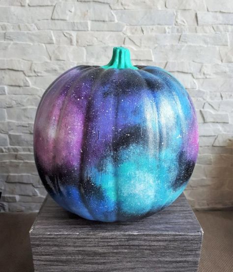 Galaxy Pumpkin Ideas to Spice Up Your Halloween Pumpkin Painting Ideas Themes, Pumpkin Painting Theme Ideas, Space Pumpkin Painting, Planet Pumpkin Painting, Galaxy Pumpkin Painting, Space Painted Pumpkin, Celestial Pumpkin Painting, Galaxy Painted Pumpkin, Spaceship Pumpkin