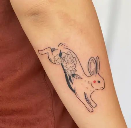 ‘Bunny’ is the common name for the rodent species known as the Rabbit. They are considered cute, intelligent, social, and loving beings. These cute rabbits are regularly touched because they represent purity, charity, and rebirth. Rabbits and the moon’s phases are connected. The rabbit foot symbolizes wealth, happiness, and luck in many cultures. These are … 51 Rabbit Tattoo Designs to Embrace Your Inner Free Spirit Read More » The post 51 Rabbit Tattoo Designs ... Chinese Zodiac Bunny Tattoo, Celtic Rabbit Tattoo, Chinese Bunny Tattoo, Zodiac Rabbit Tattoo, Rabbit And Flower Tattoo, Matrix Rabbit Tattoo, Leaping Rabbit Tattoo, Bunny Knee Tattoo, Japanese Bunny Tattoo