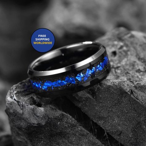 "Galaxy Meteorite & Blue Opal Wedding / Engagement / Anniversary / Promise Rings for Him or Her  ✦ Materials: Tungsten Carbide, Crushed Royal Blue Opals & Muonionalusta Meteorite  ✦ Color: Black & Blue ✦ Comfort Fit & Polished  ✦ Band width: 8mm, 6mm & 4mm ✦ Fit is true to size. ✦ 100% Cobalt-Free & Hypoallergenic, ideal for those with sensitive skin. ✦ FREE Wooden Box included - costs $28 on etsy.  ✦ Free & Fast Shipping globally - Arrives in just 4-6 Working day in the US  ✦ Can be custom engr Black And Blue Mens Wedding Ring, Black And Blue Wedding Bands For Men, Blue Mens Wedding Bands, Blue Men’s Wedding Band, Male Wedding Bands Sapphire, Blue Wedding Rings Men, Mens Promise Rings, Mens Sapphire Wedding Band, Mens Wedding Bands Blue