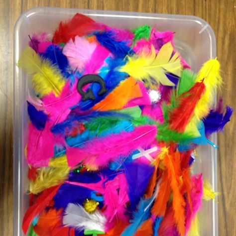 Alphabet sensory tub / bin using feathers and pom poms Feather Sensory Bin, Sensory Tubs, Sensory Tub, Infant Room, Monthly Calendars, Sensory Bin, Indian Heritage, Sensory Bins, Sensory Play