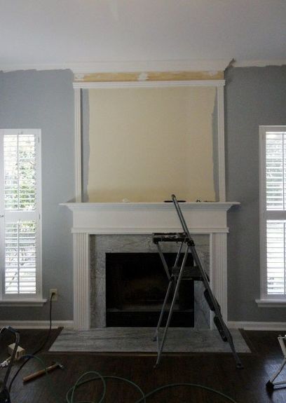 We used molding to extend our standard fireplace to the ceiling. Before, it was simple and standard. We just used a few pieces of molding and wood as well as white trim paint to give it a dramatic look. Before & After We painted everywhere except over the fireplace. We used a nail gun to add molding to form our fireplace shape. We added thick boards at the top to mimic the existing mantle. Here's how it all looked! We caulked all of the seams. We painted the entire a… Builder Grade Fireplace, Painting Trim White, Diy Fireplace Makeover, Fireplace Update, Brick Fireplace Makeover, Shiplap Fireplace, Old Fireplace, Builder Grade, Fireplace Remodel