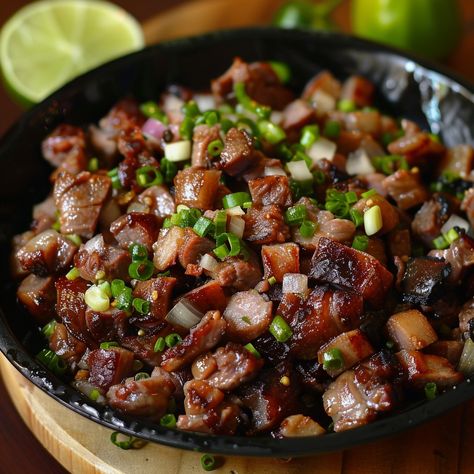 🍳 Try our flavorful Sisig! 🥢✨ #FilipinoFavorites #SisigTime Sisig (Chopped Pork and Liver) Ingredients: Pork belly (500 g) Chicken liver (100 g) Onion, chopped (1) Green chili, chopped (1) Soy sauce (3 tbsp) Vinegar (2 tbsp) Calamansi juice (2 tbsp) Garlic, minced (3 cloves) Oil (2 tbsp) Salt and pepper to taste Instructions: Boil pork belly until tender. Grill until crispy, then chop into small pieces. Sauté garlic, onion, and chicken liver in oil until liver is cooked. Chop liver. Combi... Pork Sisig, Pork Liver, Calamansi Juice, Chili Salt, Instagram Recipes, Twisted Recipes, Chicken Liver, Green Chili, Trending Recipes