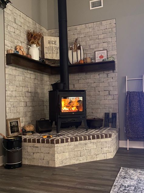 Brick Stove Fireplace, Wood Burning Stove Enclosure, Corner Stove Mantle, Wood Stove With Brick Surround, Corner Brick Wood Stove, Wood Stove Corner Ideas Living Room, Corner Wood Stoves Ideas Living Rooms, Woodstove Surrounds Corner, Buck Stove Fireplace Ideas