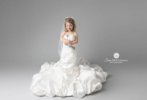 A wedding dress session is ideal for children who love to get dressed up. The dress up stage of childhood is fleeting but this session was an amazing way to hold onto it forever. This sweet little girl was very excited to be able to wear mom’s wedding gown. She was full of smiles and giggles at our session together. Miss M had clearly been looking forward to this session for awhile! Toddler Wearing Moms Wedding Dress, Moms Wedding Dress, Mom Wedding Dress, Toddler Wearing, Mom Wedding, Mom And Daughter, Wedding Dresses Photos, A Wedding Dress, Very Excited