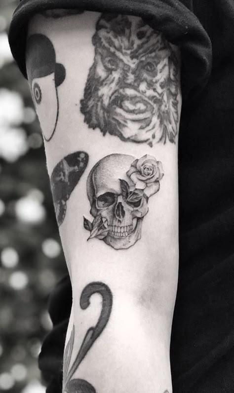 Skull & Rose Tattoo - TattManiaTattMania Skull And Black Rose Tattoo, Sideways Skull Tattoo, Small Skull With Rose Tattoo, Small Skull And Rose Tattoo, Skull With Rose In Mouth Tattoo, Romantic Skull Tattoo, Hidden Skull Tattoos For Women, Small Skull Tattoo Ideas, Dainty Skull Tattoo