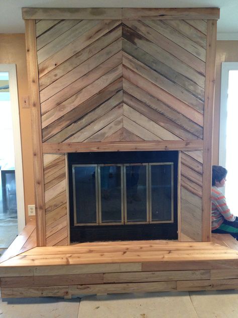 Jason's Handyman Service  Madison Ga  706-818-0315 Pallet wood herringbone fireplace Diy Herringbone Fireplace, Pallet Wood Fireplace Wall, Southern Fireplace Ideas, Chevron Wood Fireplace Wall, Barn Wood Fireplace Wall, Pallet Fireplace Wall, Diy Pallet Fireplace, Cedar Fireplace Surround, Wood Plank Fireplace Wall