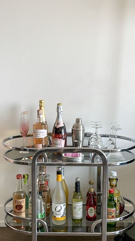 Drink Cart Aesthetic, Living Room Bar Ideas Apartments, House Bar Aesthetic, Aesthetic Bar Stools, Bar Cart In Living Room Ideas, Vintage Bar Cart Aesthetic, Aesthetic Home Bar, Silver Apartment Decor, 70s Bar Cart