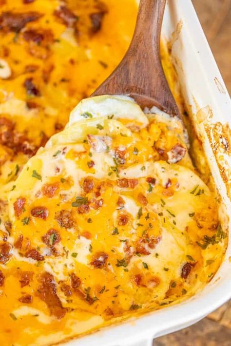 Scalloped Crack Potatoes - cheesy Au Gratin potato casserole loaded with cheddar, bacon, and ranch! Everything cooks in the same pan - easy cleanup! Only 5 ingredients! Potatoes, heavy cream, ranch seasoning, cheddar cheese, and bacon. I could make a meal out of just these potatoes. I'm still thinking about them! SO good! An easy side dish that is ready in under an hour! #potatoes #casserole #cheese #bacon Au Gratin Potato Casserole, Scalloped Potatoes With Bacon, Plain Chicken Recipe, Cream Cheese Potatoes, Marinated Pork Chops, Scalloped Potatoes Cheesy, Potato Pasta, Bacon Potato, Potatoes Au Gratin