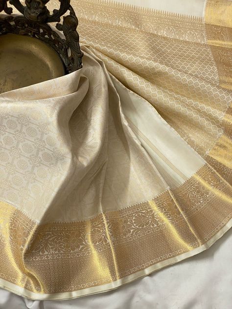 Off white 2g gold zari waving Bridal - wedding silk - soft silk saree - Wedding saree for women - silk mark certified Silk Mark Certified Pure Kanchipuram Soft silk saree - Pastal pure silk saree - saree for the wedding - saree for women Beautiful traditional Kanchipuram in lovely colour combination ✓ KANCHIPURAM PURE SILK HANDLOOM  SAREE WITH 2 GRAM JARI  ✓ Silk Mark Certified ✓ 100% Pure Kanchipuram ✓ Handloom silk Kanchipuram silk sarees, also known as kanjivaram silk sarees, are woven from p White And Gold Saree, Gold Silk Saree, Onam Outfits, Off White Saree, Latest Silk Sarees, Girly Style Outfits, Haldi Outfits, Blue Silk Saree, Kanjivaram Sarees Silk