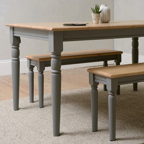 For a touch of sophisticated farmhouse charm in smaller kitchens, the Farmhouse Storm Grey Table could be just what you are looking for. Seating four comfortably, it could seat six at a pinch, especially if they were closely acquainted. With a scrubbed pine top and contrasting, grey painted, turned legs, this solid pine table is perfect for family gatherings and dinner parties with friends. We've teamed it here with 2 of the matching Painswick Storm Grey Dining Benches. Bench Dining Room Table, Grey Kitchen Table, Sophisticated Farmhouse, Farmhouse Dining Benches, Elegant Living Room Furniture, Upholstered Dining Bench, Traditional Dining Tables, Kitchen Table Wood, Dining Room Paint