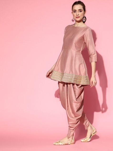 Buy pleasing dirty pink panelled kurta with dhoti pants and organza dupatta for women which is crafted from silk blend fabric. This beautiful style kurta set goes perfectly for upcoming festive season and grand events. Dhoti Kurta Sets For Women, Frock And Dhoti Salwar, Peplum With Dhoti Pants, Peplum Kurti With Dhoti Pants, Indian Kurta Styles For Women, Dhoti Anarkali Dress, Pakistani Dhoti Suits, Suit Dhoti Design, Pink Dhoti Outfit