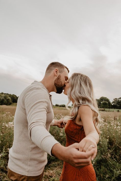 Rust Dress Engagement Pictures, Rust Engagement Pictures, Orange Dress Couple Outfit, Burnt Orange Engagement Photos, Rust Orange Dress, Spring Engagement Photos Outfits, Field Engagement Photos, Engagement Photo Outfit, Engagement Shoot Outfit