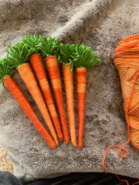 Spring and Easter are right around the corner, and crafting for them is what’s getting us through this long winter. These fun wool carrots are just the thing for a rainy afternoon!      You’ll need some orange wool, green wool, school glue, cardstock, tape, an old paint brush, a magazine or newspaper, and scissors. I chose this multi-orange wool so that my carrots would vary in colors.   First, roll your card from the end into a cone for your carrot base, this can be any size you want.… Wall Vase Decor, Boys Room Diy, Desk Makeover Diy, Diy Chalkboard Sign, Rustic Wood Lanterns, Rainy Afternoon, Drop Cloth Curtains, Easy Easter Crafts, Spring Decorating