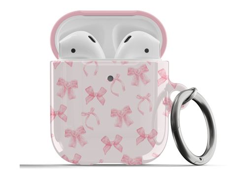 𝗗𝗘𝗦𝗖𝗥𝗜𝗣𝗧𝗜𝗢𝗡: Protect your AirPods with our Pink Coquette Bows AirPods Case! This cute AirPods case features cute light pink bows on a light pink background. ∙ Impact absorbing & scratch resistant case  ∙ Wireless charging compatible ∙ Glossy or matte finish ∙ 3-piece design ∙ Materials: polycarbonate ∙ Slim and lightweight ∙ Precisely aligned port openings ∙ Includes a metal carabiner ∙ Printed in the USA ∙ 360o protection from bumps, drops, and scratches Important note: Our AirPods P Cute Pink Things, Airpods Case Aesthetic, Cute Airpods Case, Girly Christmas Gifts, Cute Airpods, Preppy Phone Case, Bows Coquette, Coquette Bows, Pink Coquette