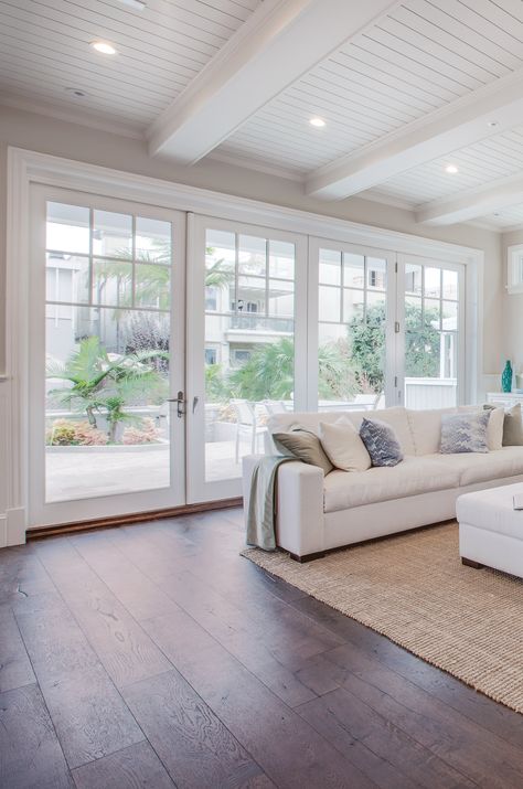 Open up your home to the outdoors! #foldabledoors #foldabledoor #indooroutdoor #largewallofwindows #wallofwindows #whiteinterior #moderncountry #whitetrim #whitetrimdoors #whitedoors #patio #patiodoor #foldabledoor #foldingdoor #kolbewindowsanddoors #kolbewindows Beach House Sliding Glass Doors, Large Glass Patio Doors, Large Patio Doors Living Room, Multislide Patio Doors, Double French Doors Living Room, Foldable Doors, Coastal Sunroom, Living Room Patio Doors, Coastal Pool