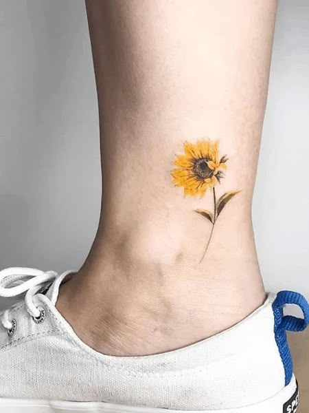 20 Elegant Ankle Tattoos for Women in 2020 - The Trend Spotter Sunflower Tattoo Ideas, The Trend Spotter, Ankle Tattoos For Women, Anklet Tattoos, Ankle Tattoos, Sunflower Tattoos, Sunflower Tattoo, Ankle Tattoo, Foot Tattoos