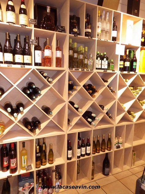 Wine Shop Interior Design Liquor Store, Bar Shelves Ideas Liquor, Wine Boutique Shops, Concealed Bar, Wine Store Design, Wine Shop Interior, Wine Bar Design, Gift Shop Interiors, Store Shelves Design