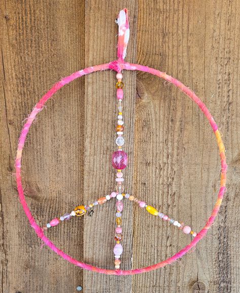 Pink & Orange Beaded Peace Sign 💗 10" fabric wrapped metal hoop with various beads in the center, with a fabric loop for hanging. 🧡 Definitely a one-of-a-kind piece of wall art. ☮ PennyJaneHandmade.com ☮ Peace Sign Crafts, Beaded Peace Sign, Peace Sign, Pink Orange, Pink And Orange, Beads, Orange, Wall Art, Wall