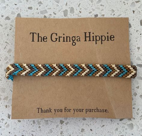 "This woven friendship bracelet features the classic chevron pattern in four colors.  The bracelet can be made as pictured (in teal, cream, tan and brown) or in any 4 colors of your choice.   Width: just short of 1/2\" (7/16\")" Chevron Friendship Bracelets Colors, Thread Bracelet Color Combos, Bracelets Colors Ideas, Brown Friendship Bracelet, Friendship Bracelets String, Bracelet Chevron, Chevron Friendship Bracelets, Bracelet Colors, Western Bracelets