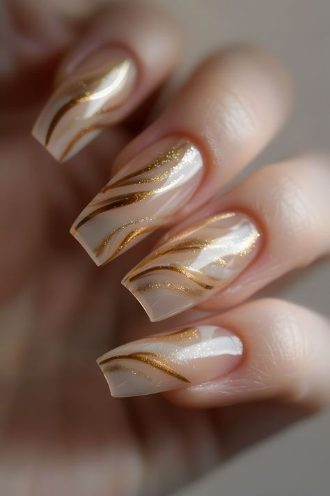 Add a touch of luxury with sheer beige nails and gold foil swirls. Follow us for more stunning nail art ideas. Visit our blog on the bride’s ultimate guide to perfect wedding nails. Simple Summer Nails | Elegant Touch Nails | Nails Inspo 2024 | Nails Design Summer | Wedding Day Nails | Minimalist Nails | Nails 2024 Summer | Nails With Charms | Nails Summer 2024 | Nails Elegant Classy | Nails Easy | Almond Nails | White Nails | Elegant Nails | Nails Design | Nails Design With Rhinestones Summer Nails Wedding, Elegant Summer Nails, Nails For Wedding, White Nails With Gold, Elegant Touch Nails, Nails With Gold, Wedding Mother Of The Bride, Natural Nail Designs, Gold Glitter Nails