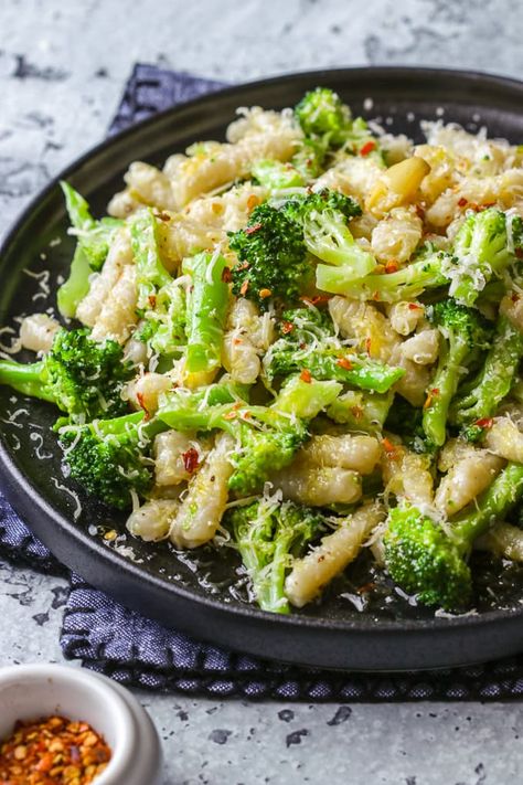 Learn how easy it is to make homemade cavatelli from scratch. This popular Italian pasta and broccoli dish is served with a simple sauté of olive oil, smashed garlic cloves and red chilli flakes. Cork Screw Pasta Recipes, Pasta With Garlic And Oil, Broccoli And Cavatelli, Olive Oil Pasta With Veggies, Broccoli And Cavatelli Recipe, Cavatelli And Broccoli Sausage, Garlic And Olive Oil Pasta With Broccoli, Garlic And Oil Pasta With Broccoli, Pasta Broccoli Garlic And Oil