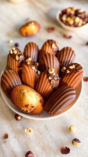 Arushi Hasija | Mills & Buns on Instagram: "🐚 HAZELNUT MADELEINES 🐚 Madeleines are the perfect cross between a cake and a cookie- they’re super light and buttery and often made in the classic shell shape 🥰 Don’t worry if you don’t have a shell mould though, you could bake it in a cupcake mould and it’ll taste the same!! They’re characterised with a cute bump on the surface, do you see it in my video? ❤️ The batter is pretty straightforward and comes together in one bowl, only difficult part Madeleines Christmas, Christmas Madeleines, Food Crush, French Pastries, Bread And Pastries, Baking Ingredients, Monster Cookies, Hazelnut, Buns