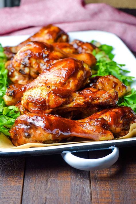 Oven Baked BBQ Chicken Drumsticks made with a sweet and tangy BBQ sauce, baked juicy and delicious in the oven! These DRUMS are a simple family favorite perfect for an easy weeknight meal, but yummy enough for Sunday Dinner. AND after all they are finger lickin' good y'all! #BBQChicken #OvenBakedBBQChicken #ChickenDrumsticks Chicken Leg Recipes Oven, Baked Bbq Chicken Legs, Chicken Legs In Oven, Oven Baked Bbq Chicken, Bbq Chicken Drumsticks, Bbq Chicken Legs, Chicken Breast Crockpot Recipes, Crockpot Chicken Breast, Baked Chicken Drumsticks