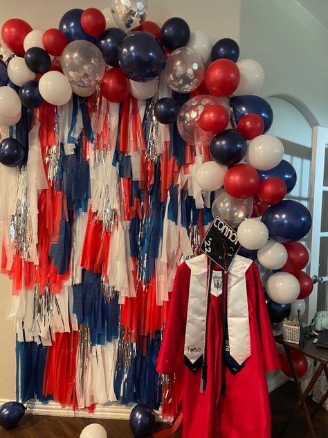 Used plastic table cloths to do backdrop and the silver are door fringes Night Time Graduation Party Ideas, Red White And Blue Fringe Backdrop, Red Blue And Silver Party Decorations, Cheer Banquet Backdrop, Navy And Red Graduation Party, Red White And Blue Photo Backdrop, Patriotic Graduation Party, Red White Blue Graduation Party Ideas, Red White And Blue Graduation Party