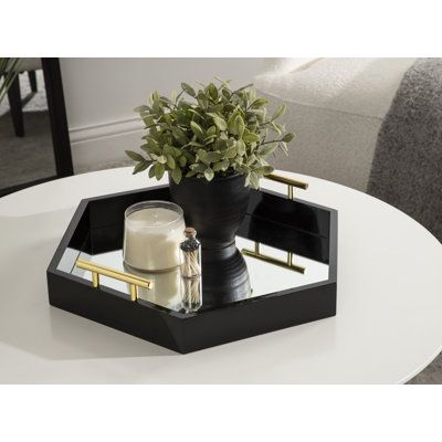 Bring modern glam style into your home with this hexagon-shaped decorative accent tray with polished metal handles. Place this charming tray on your entrance console table as a trinket tray to hold your keys and mail as you come and go. This hexagon tray is spacious enough to hold documents or file folders on a home office desk. This tray can also be used as a decorative accent on an ottoman to hold your beverages or on your vanity for makeup organization. Constructed of solid MDF with a glossy Black Kitchen Accents, Black Tray Decor, Ottoman Tray Decor Ideas, Entrance Console Table, Entrance Console, Sleek Decor, Console Table Styling, Accent Tray, Casual Decor