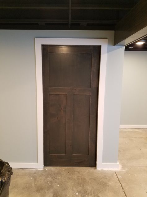 Craftsman 3 panel Knotty Alder pocket door stained with white trim, black 1 x 3 crown at ceiling 1x3 Door Trim, White Trim With Dark Doors, White Woodwork With Stained Doors, Stained Pocket Doors, White Trim Brown Doors, Stained Door White Trim, Stained Door With White Trim, White Trim Stained Doors, Brown Doors White Trim