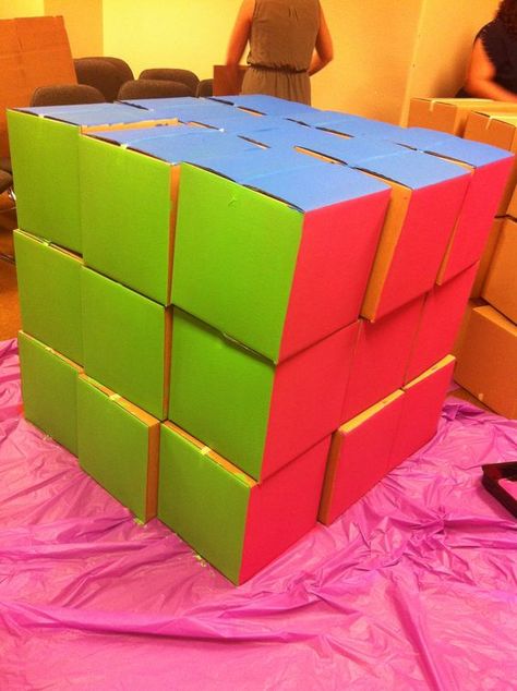 80's party Giant Rubix cube out of 12x12 cardboard boxes and acrylic paint.  Fun party game idea!: Giant Rubix Cube, Summer Reading Program Ideas, Reading Program Ideas, Life Size Games, Grease Party, Decades Party, Retro Night, 80s Party Decorations, 80's Theme