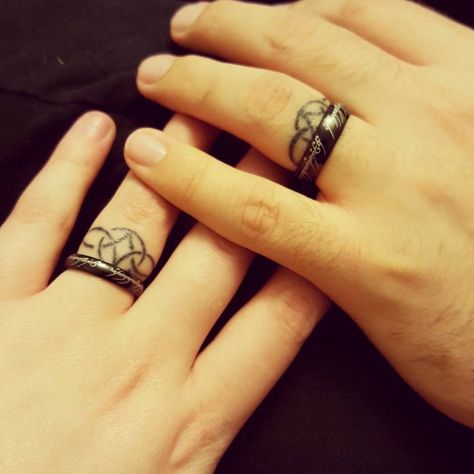 50 Cool Wedding Ring Tattoos To Express Their Undying Love | EcstasyCoffee Wedding Ring Finger Tattoos, Ring Tattoo Designs, Wedding Band Tattoo, Romantic Wedding Rings, Tattoo Band, Ring Tattoo, Wedding Ring Finger, Wedding Ring Tattoo, Tattoo Wedding Rings