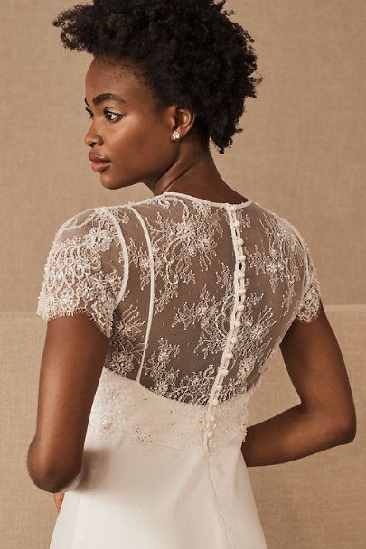 Scattered beading adds a subtle shimmer to this exquisitely intricate topper in sheer lace. Scalloped edges and a button back complete this sophisticated style. Joy Proctor, Wedding Dress Cover Up, Bridal Topper, Wedding Dress Separates, Wedding Dress Cover, 2 Piece Wedding Dress, Art Rings, Dress Topper, Catherine Deane