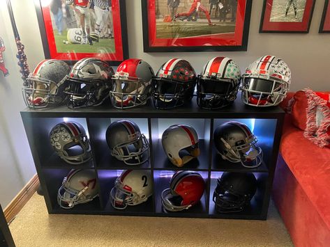 Nfl Man Cave Ideas, Mini Helmet Display Ideas, Nfl Helmet Display Ideas, Helmet Display Ideas, Football Helmet Wall Display, Football Helmet Display Cabinet, Nfl Man Cave, Sports Memorabilia Display, Ohio State Rooms