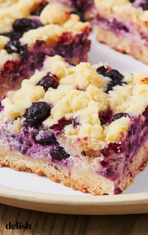 Lemon Blueberry Pie Bars are SO much easier than baking a whole pie. Get the recipe at Delish.com. #recipe #easy #easyrecipes #delish #lemon #blueberry #pie #bars #baking #dessert #dessertrecipes #spring #springbaking #springdesserts #springrecipes #cheese #berries #fruit Berry Crumble Bars, Blueberry Crumb Bars, Blueberry Pie Bars, Blueberry Crumble Bars, Blueberry Bars, Crumb Bars, Berry Crumble, Shortbread Bars, Blueberry Desserts