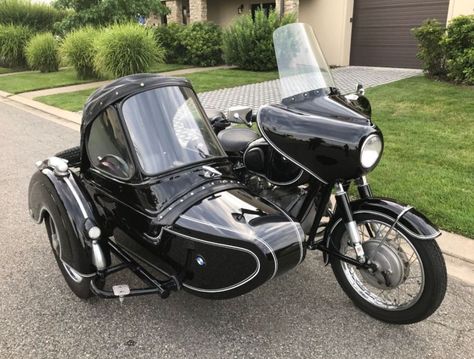 Here’s a combination of two German-made black beauties – a BMW R50/2 paired with a Steib TR500 sidecar. The TR500 was built specifically to be attached to bigger bikes like the offerings from Zundapp and BMW. It’s not as pretty as the bullet-shaped “S” models, but it was comfortable and rugged, which is why it was also used in service applications for local governments. Motorbike With Sidecar, Classic 350 Royal Enfield, Bike With Sidecar, Bicycle Sidecar, Three Wheel Bicycle, Ural Motorcycle, Bike Bmw, Van Conversion Interior, Motorcycle Sidecar