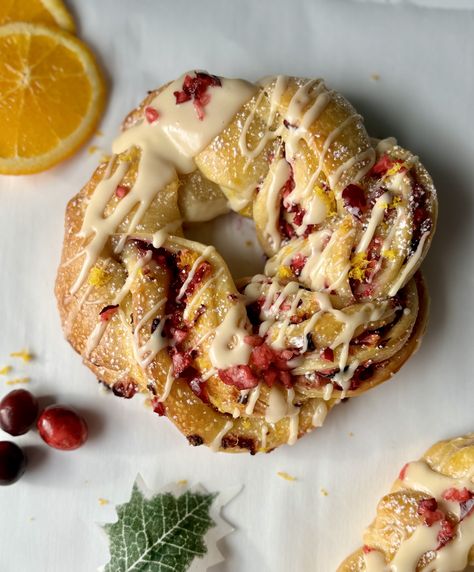 Cranberry Orange Sourdough Brioche Wreaths (with a maple orange glaze) Orange Cranberry Focaccia, Sourdough Cranberry Orange Bread, Sourdough Cranberry Orange Muffins, Orange Cranberry Sourdough Bread, Sourdough Orange Rolls, Cranberry Orange Sourdough Bread, Sourdough Wreath, Sourdough Christmas Recipes, Cranberry Orange Sourdough